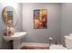 Powder room with pedestal sink and decorative art at 285 Centennial Olympic Park Nw Dr # 401, Atlanta, GA 30313
