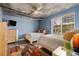 Spacious bedroom with two beds, dresser, and city views at 285 Centennial Olympic Park Nw Dr # 401, Atlanta, GA 30313