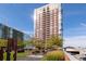 Brick building exterior with landscaped grounds and seating areas at 285 Centennial Olympic Park Nw Dr # 401, Atlanta, GA 30313