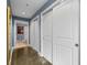 Hallway with white doors and polished concrete floors at 285 Centennial Olympic Park Nw Dr # 401, Atlanta, GA 30313