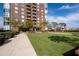 Expansive green lawn area with paved pathways and landscaping at 285 Centennial Olympic Park Nw Dr # 401, Atlanta, GA 30313