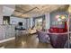 Open living space with multiple seating areas and large windows at 285 Centennial Olympic Park Nw Dr # 401, Atlanta, GA 30313