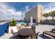 Rooftop pool with tables, chairs and surrounding building at 285 Centennial Olympic Park Nw Dr # 401, Atlanta, GA 30313