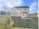 Two-story house with backyard patio and grassy lawn at 585 Windsor Brook Ln, Lawrenceville, GA 30045