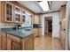 Kitchen features L-shaped granite countertops and wood cabinets at 3854 Westmoreland Nw Dr, Kennesaw, GA 30144