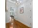 Bright hallway with hardwood floors, leading to bedrooms and other rooms at 2297 Hamilton Mill Pkwy, Dacula, GA 30019