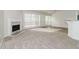 Bright living room with fireplace and carpet flooring at 3232 Kibbe Ct, Lawrenceville, GA 30044