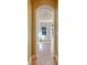 Elegant hallway with hardwood floors and arched doorway at 908 Juniper Ne St # 205, Atlanta, GA 30309