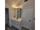 Bright bathroom with white vanity, modern fixtures, and view of shower at 1420 Midland Way, Lawrenceville, GA 30043