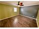 Spacious bedroom with wood-look floors and ceiling fan at 1581 Cheryl Leigh Dr, Riverdale, GA 30296