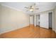 Bedroom with hardwood floors, ceiling fan, and large closet at 3623 Stonewall Se Ct, Atlanta, GA 30339