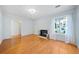 Light-filled living room with hardwood floors, fireplace, and chandelier at 3623 Stonewall Se Ct, Atlanta, GA 30339