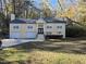 Beautiful two-story house with a two-car garage and well-maintained lawn at 5005 Dublin Dr, South Fulton, GA 30331