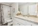 Clean bathroom with granite countertop, white cabinets, and a bathtub at 318 Crimson Dr, Union City, GA 30291