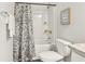 Well-lit bathroom featuring a shower/tub combo and patterned shower curtain at 318 Crimson Dr, Union City, GA 30291