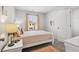 Bright bedroom with a comfortable bed, window, and ample closet space at 318 Crimson Dr, Union City, GA 30291