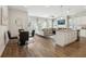 Open concept kitchen with island, stainless steel appliances, and hardwood floors at 318 Crimson Dr, Union City, GA 30291