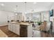 Open concept kitchen with island, stainless steel appliances, and hardwood floors at 318 Crimson Dr, Union City, GA 30291