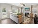 Bright living room featuring fireplace, hardwood floors, and large windows at 318 Crimson Dr, Union City, GA 30291
