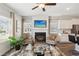 Open living room with a fireplace and access to the kitchen at 318 Crimson Dr, Union City, GA 30291