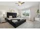Large main bedroom with plush carpet and a comfortable sitting area at 318 Crimson Dr, Union City, GA 30291