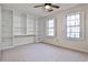 Bedroom with built-in shelving and window seat at 1 Paper Mill Nw Pl, Atlanta, GA 30318