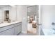 Bathroom with double vanity and access to bedroom at 262 Friendship Oak Way, Hampton, GA 30228