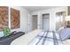 Spacious bedroom with gray and white bedding and large closet at 262 Friendship Oak Way, Hampton, GA 30228