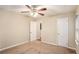 Spacious bedroom with ceiling fan and neutral carpeting at 1883 Meadow Ln, Decatur, GA 30032