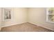 Well-lit bedroom with neutral carpeting and ample natural light at 1883 Meadow Ln, Decatur, GA 30032
