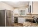 Updated kitchen, featuring granite countertops and stainless steel appliances at 1883 Meadow Ln, Decatur, GA 30032