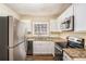 Modern kitchen with granite countertops and stainless steel appliances at 1883 Meadow Ln, Decatur, GA 30032