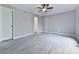 Well-lit bedroom with neutral walls and flooring at 3885 Rock Mill Pkwy, Marietta, GA 30062