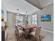 Bright dining room featuring a large wooden table and hardwood floors at 3885 Rock Mill Pkwy, Marietta, GA 30062