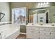 Spa-like bathroom with double vanity and large mirror at 4130 Ruby Forest Blvd, Suwanee, GA 30024