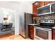 Modern kitchen with stainless steel appliances and wood cabinets at 1230 Piedmont Ne Ave # 206, Atlanta, GA 30309