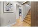 Elegant staircase with light oak treads and modern wood wall accents at 2751 Margaret Mitchell Nw Dr, Atlanta, GA 30327