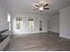 Bright living room featuring fireplace and access to backyard at 756 Vireo Walk, Loganville, GA 30052