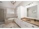 Modern bathroom with double vanity, soaking tub, separate shower, and tile flooring at 238 Fowler St, Woodstock, GA 30189