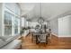 Bright kitchen and dining area with white cabinets, large windows, and globe pendant lights at 238 Fowler St, Woodstock, GA 30189