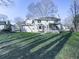 Two-story house exterior with a screened porch and landscaping at 4182 Westchester Ne Xing, Roswell, GA 30075