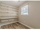 Ample storage room with built-in shelving at 265 Windmill Pointe, Lawrenceville, GA 30044