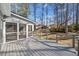 Gray deck with screened porch overlooking wooded backyard at 1237 Wynford Colony Sw, Marietta, GA 30064