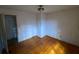 Small bedroom with hardwood floors and a door at 3955 Demooney Rd, Atlanta, GA 30349