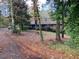 Brick ranch home nestled in a wooded lot with a long driveway at 3955 Demooney Rd, Atlanta, GA 30349