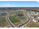 Aerial view of community with tennis courts and pond at 4231 Baden Aly, Duluth, GA 30097