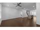 Open living room with hardwood floors and a view of the kitchen and staircase at 4231 Baden Aly, Duluth, GA 30097