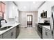 Modern kitchen with stainless steel appliances and white cabinets at 1524 S Gordon Sw St, Atlanta, GA 30310