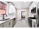 Modern kitchen with stainless steel appliances and white cabinets at 1524 S Gordon Sw St, Atlanta, GA 30310