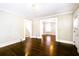 Living room with hardwood floors and views of the dining room and staircase at 1524 S Gordon Sw St, Atlanta, GA 30310